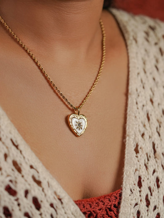 Ashborne Mahika ornate-border mother-of-pearl heart pendant on rope chain, worn on model
