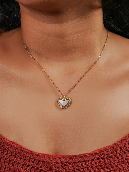 Ashborne Lata heart mother-of-pearl pave pendant worn at the collarbone