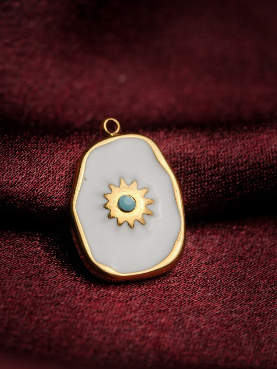Ashborne Sanya freeform white enamel pendant with a gold sunburst and turquoise centre bead