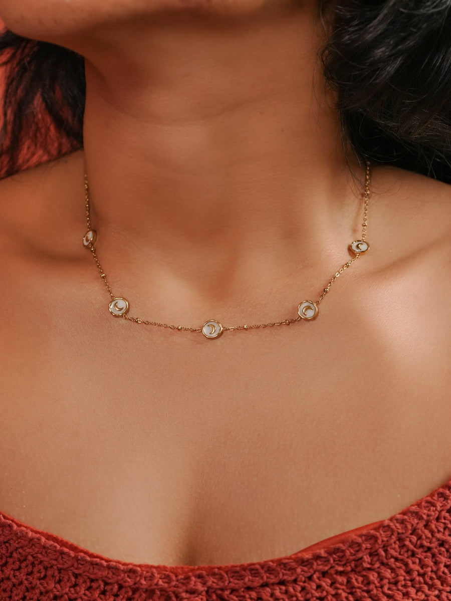 Ashborne Lavanya crescent-moon station necklace worn at the collarbone