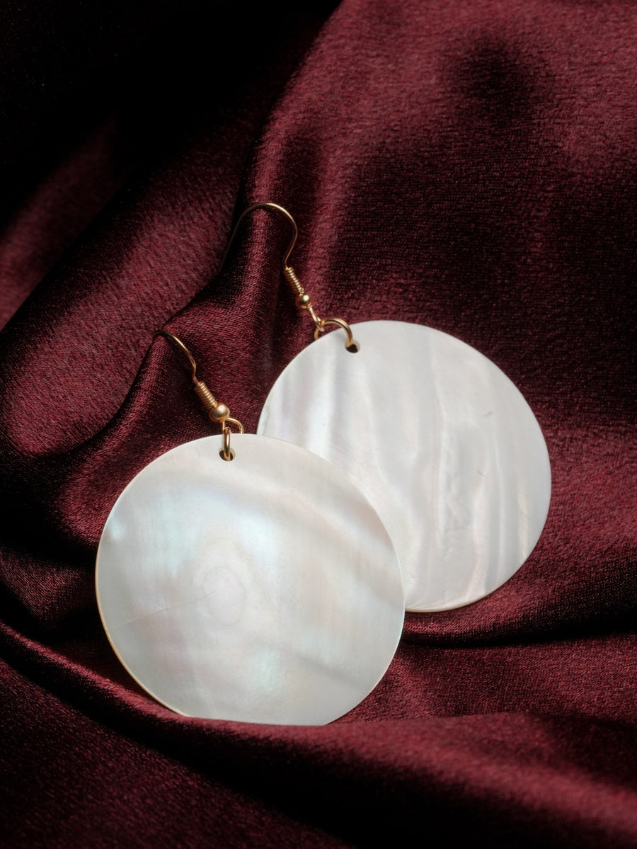 Pearl Disc Drops — round mother-of-pearl pair on velvet