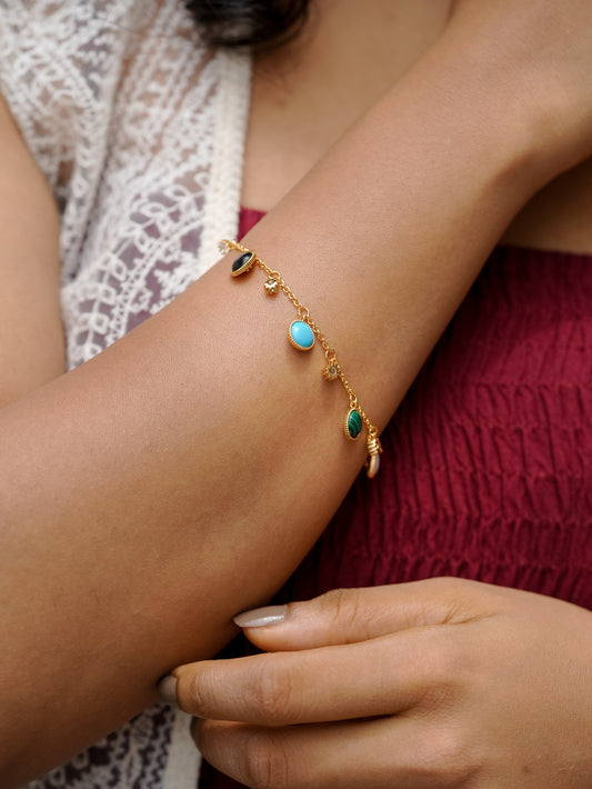 Ashborne Amrita multi-gemstone charm bracelet worn on the wrist