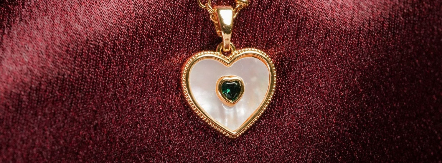 Mother-of-pearl heart pendant on a gold chain