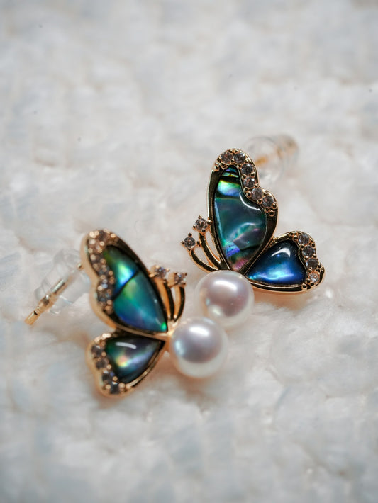 Ashborne Ela abalone butterfly stud earring worn on the ear