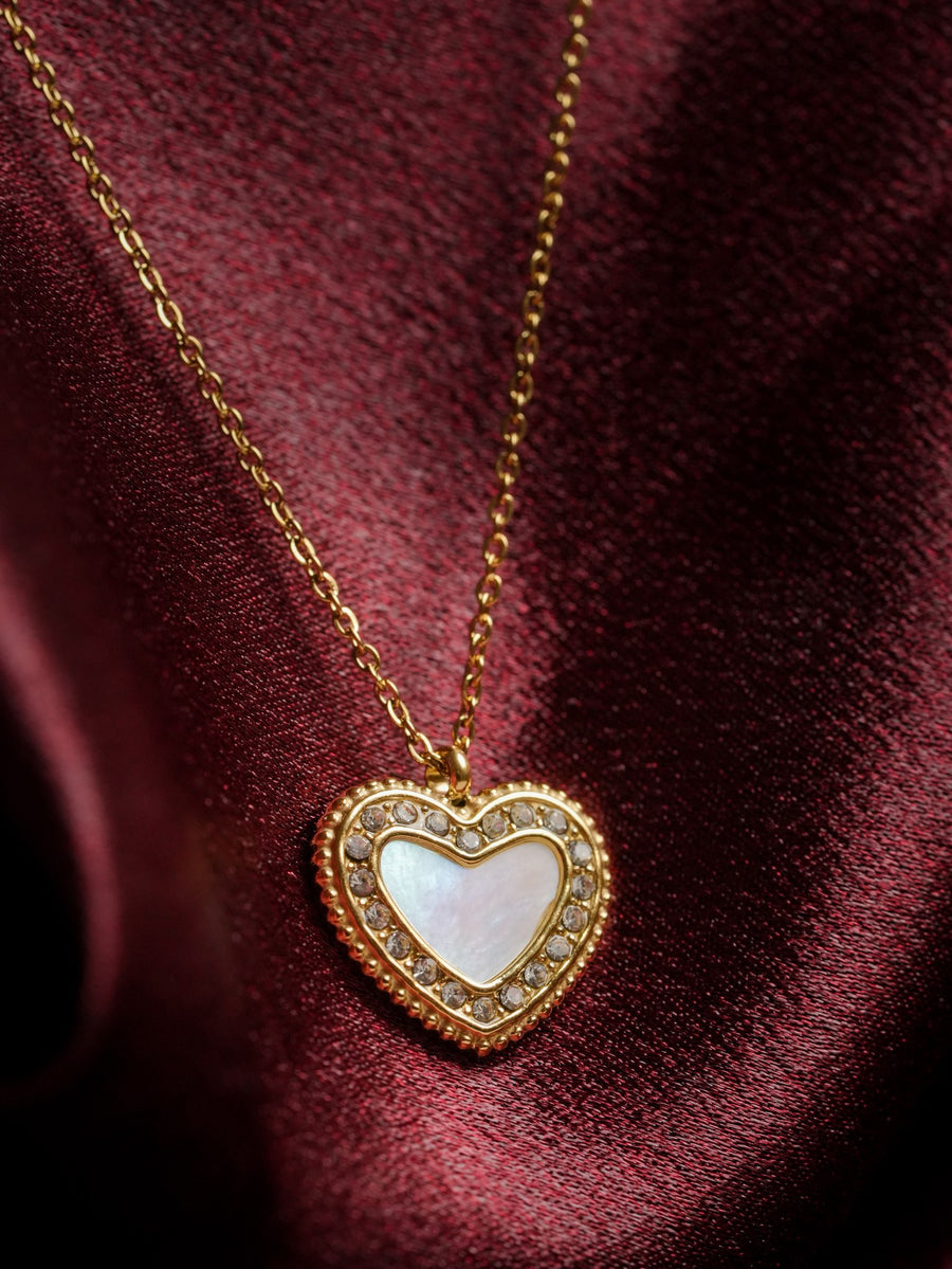 Ashborne Lata heart mother-of-pearl pendant with crystal pave border on maroon satin