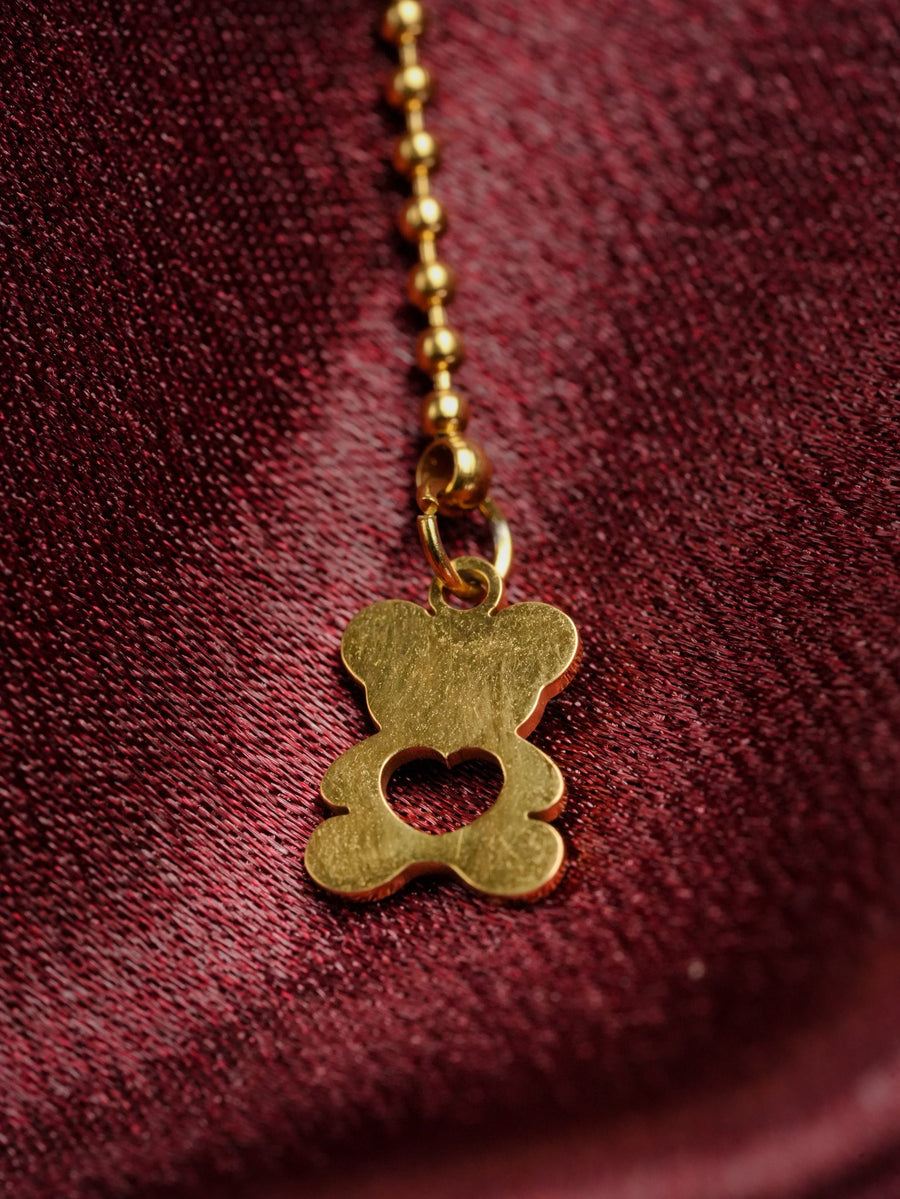 Ashborne Nayana small solid gold-tone teddy-bear charm with heart cutout on bead chain