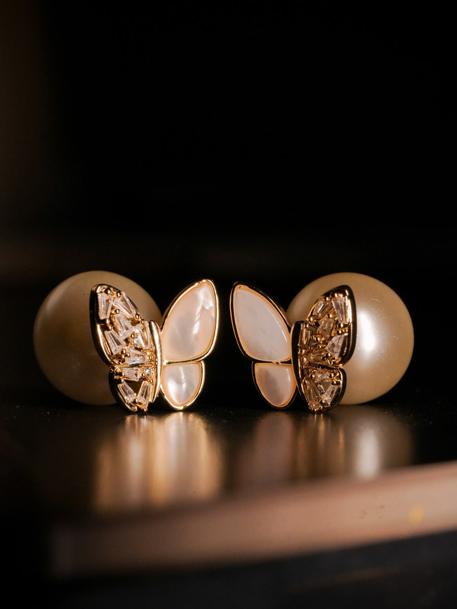 Ashborne Anika Butterfly Pearl Jacket Studs — pair on gold-tone metal with round pearls, still life