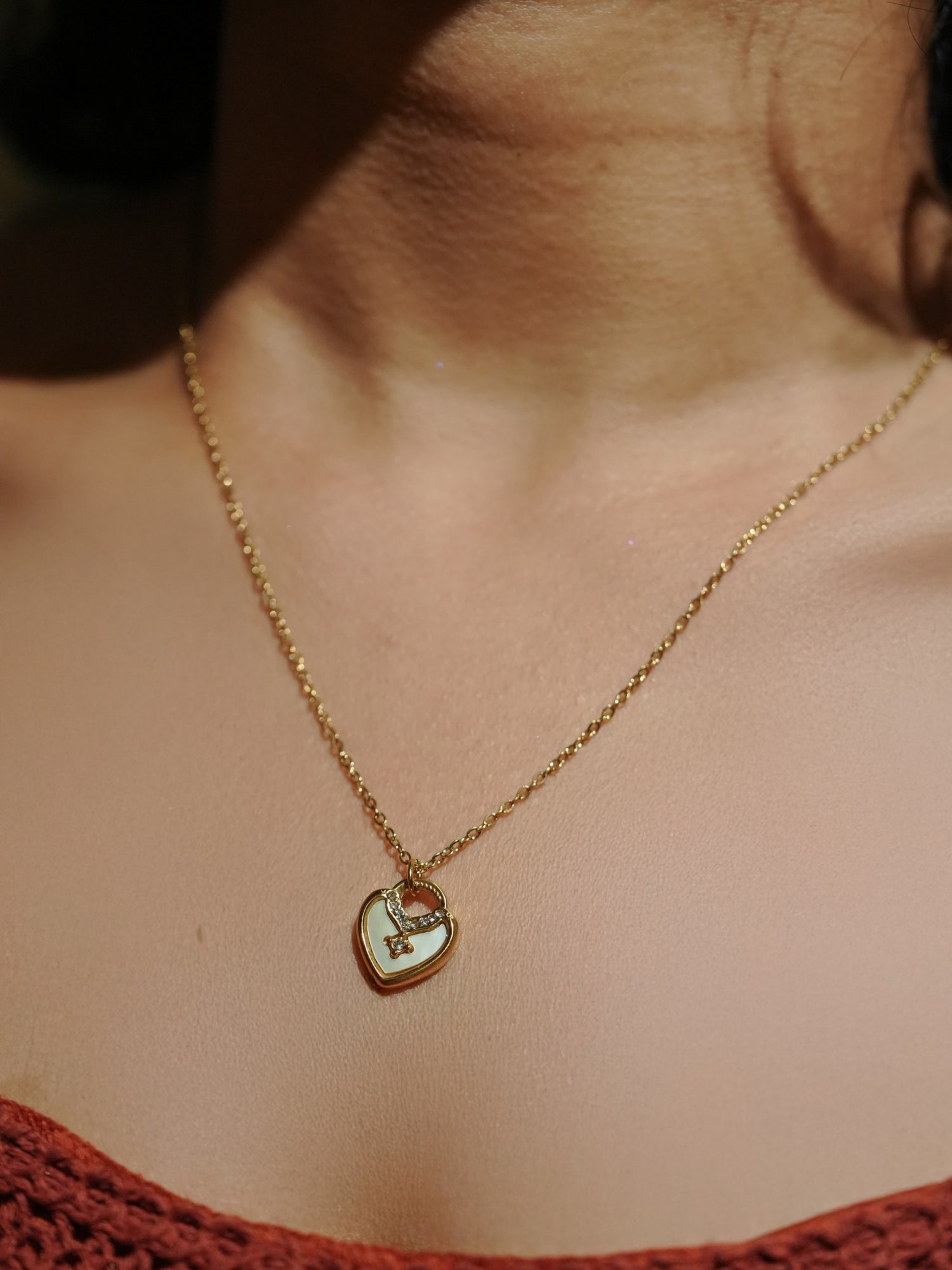 Ashborne Komal gold-tone mother-of-pearl heart pendant with crystal accent, worn