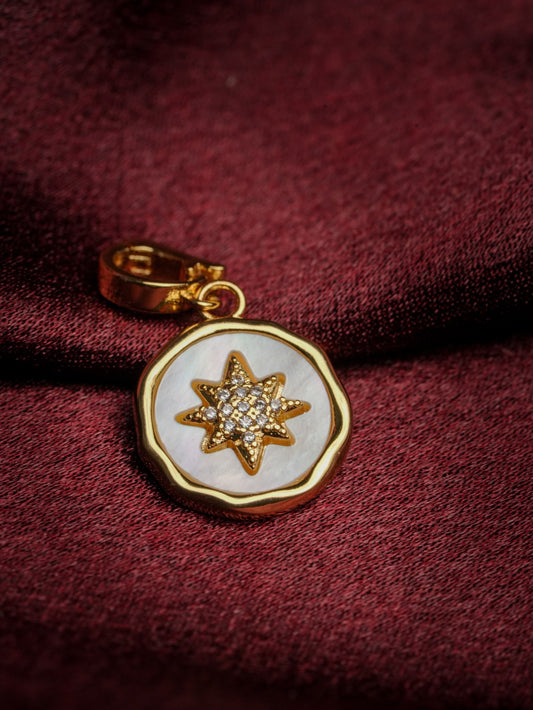 Ashborne Rashmi six-point star mother-of-pearl pendant charm with pave centre on maroon satin