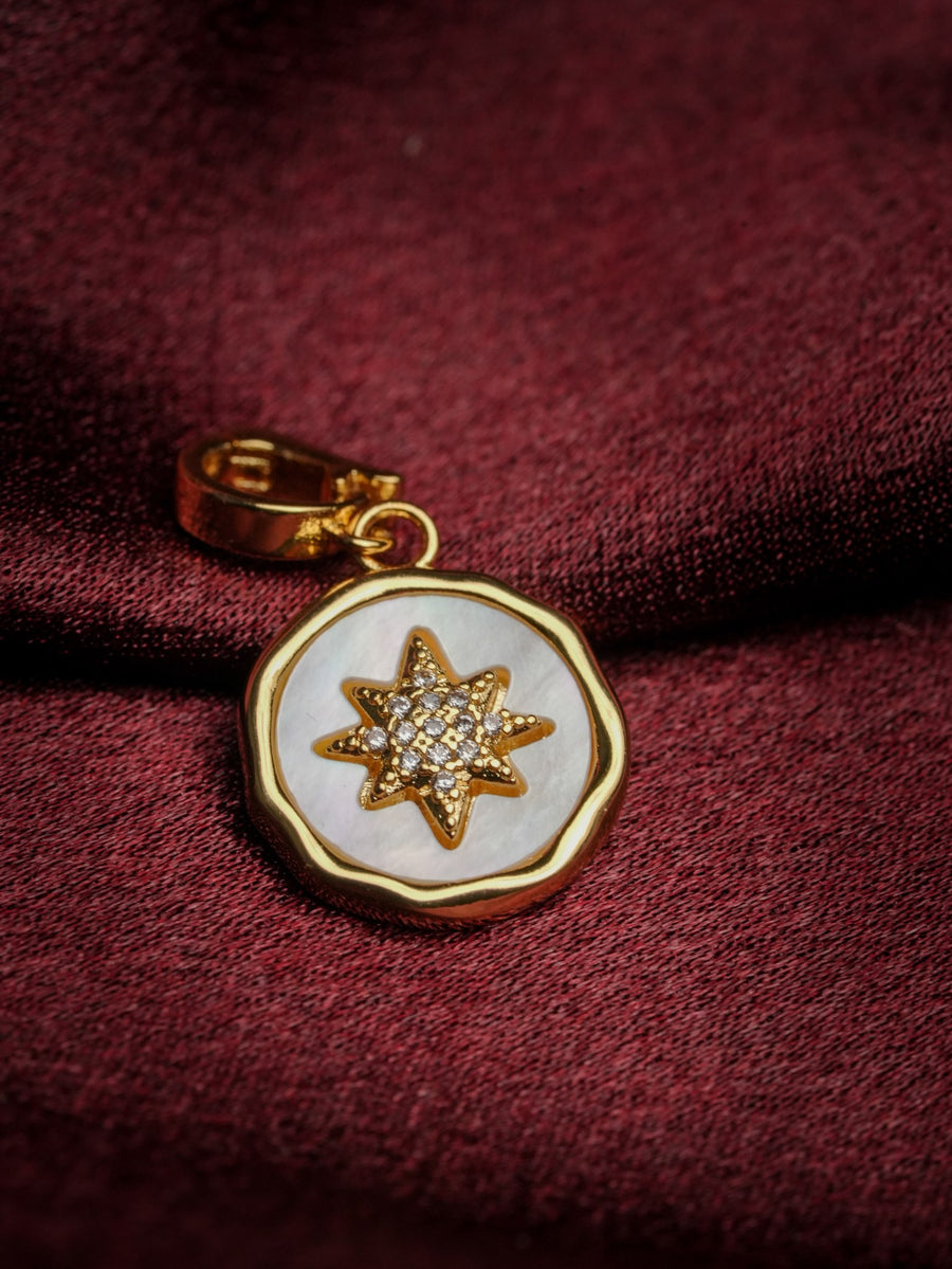 Ashborne Rashmi six-point star mother-of-pearl pendant charm with pave centre on maroon satin