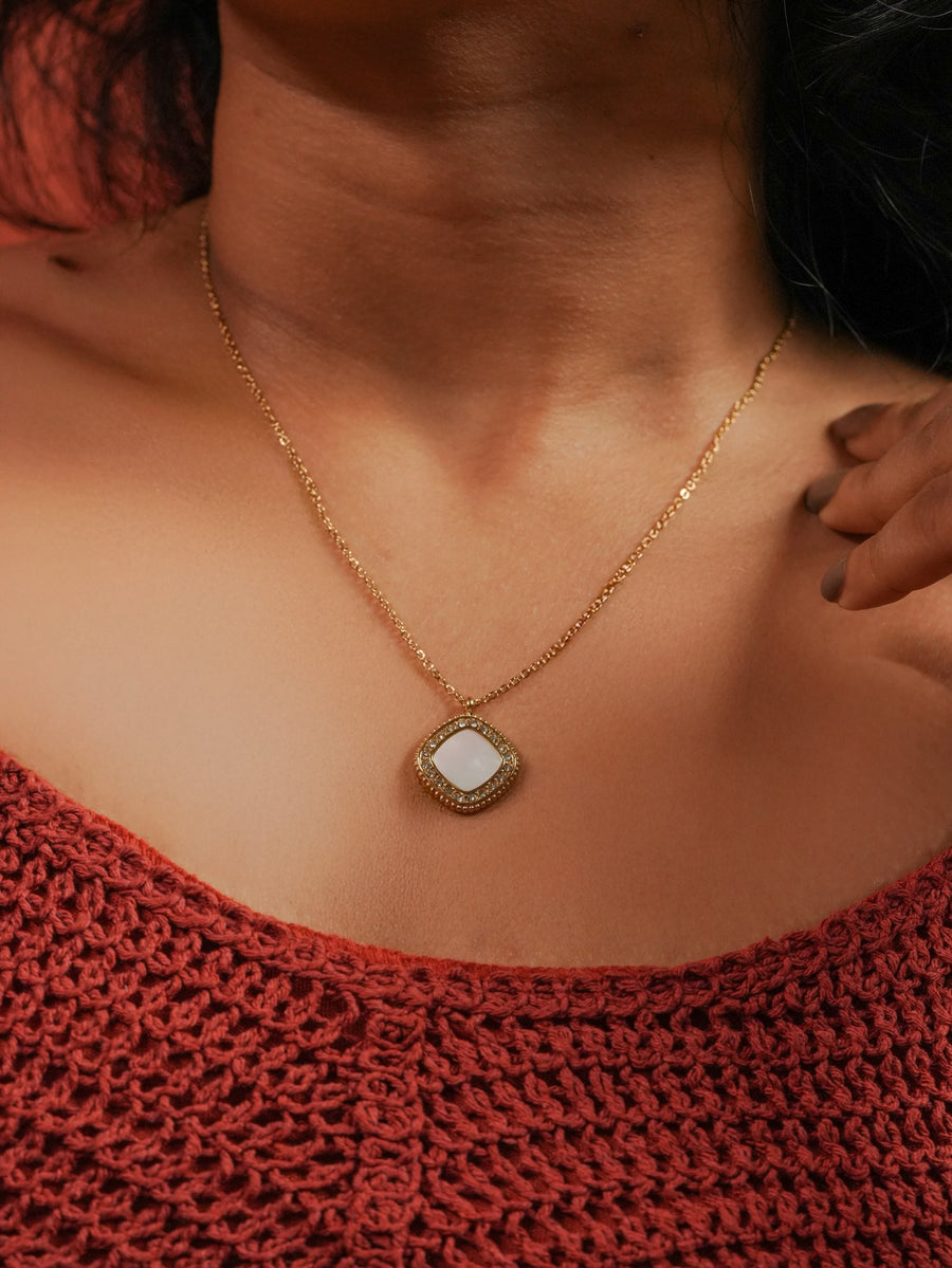 Ashborne Lakshmi cushion pave pendant worn at the collarbone