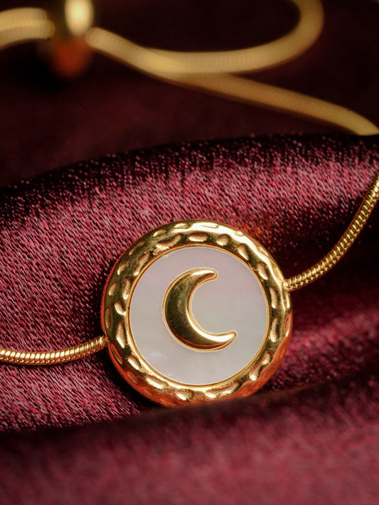 Ashborne Mishka crescent moon bracelet, mother-of-pearl disc with gold crescent on snake chain