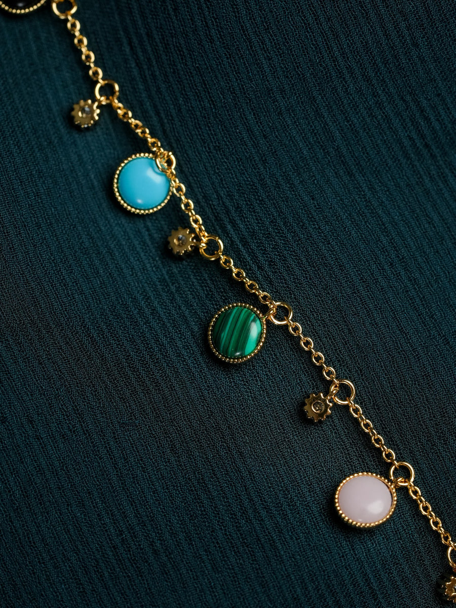 Ashborne Amrita gold-tone charm bracelet with turquoise, malachite and mother-of-pearl cabochons